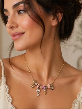 Gold Charm Necklace with Pink Beads and Key Pendant